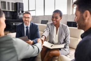 Business people shaking hands during an interview